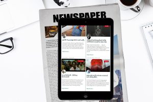 table with ipad teacup newspaper spectacles